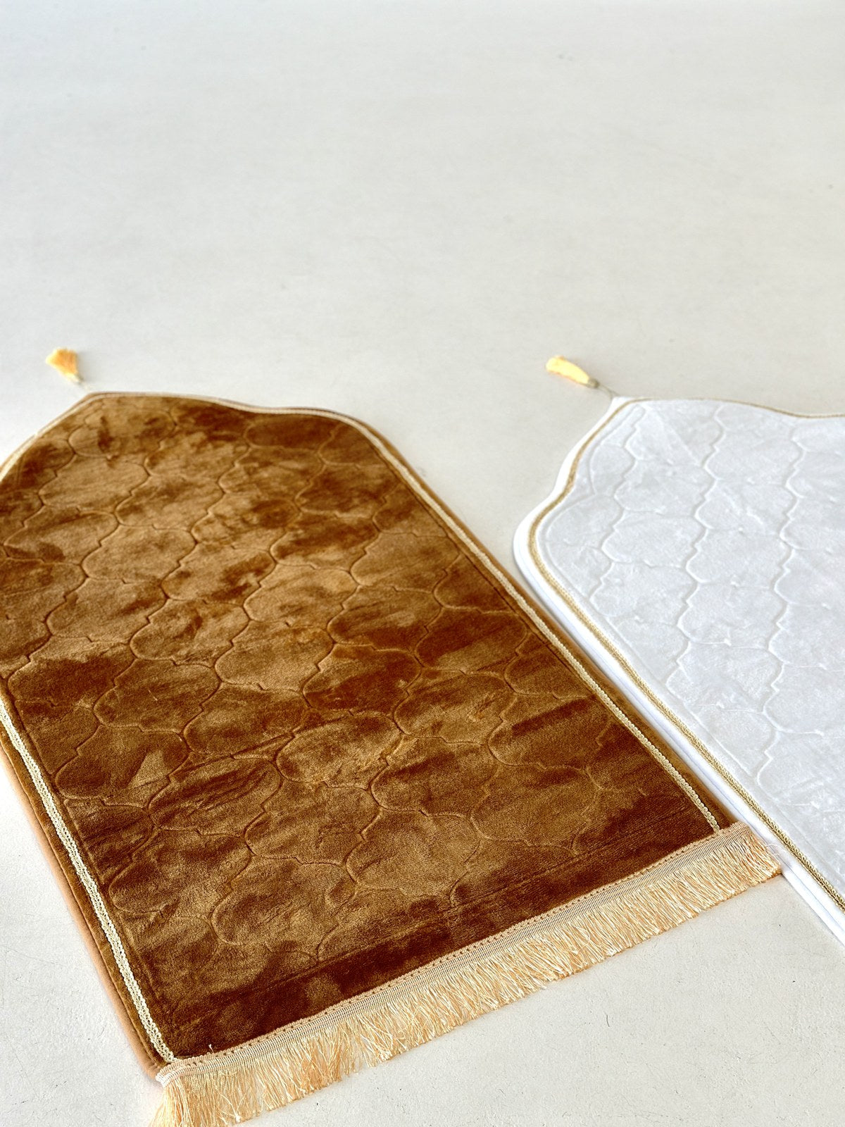 A plush prayer mat in a warm, sunlit everyday prayer space